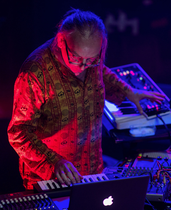 Phil Knight at a keyboard performing live with the Dots