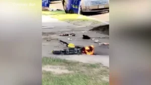 grainy footage of a bolt scooter on fire.